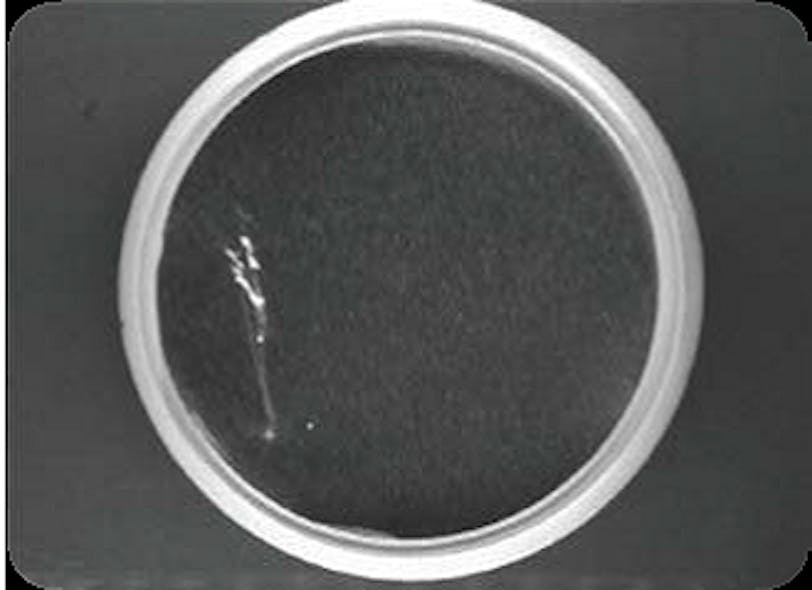 Foil seals on plastic lids checked for integrity
