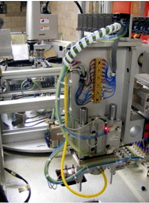 Vision assisted robot automates spigot production