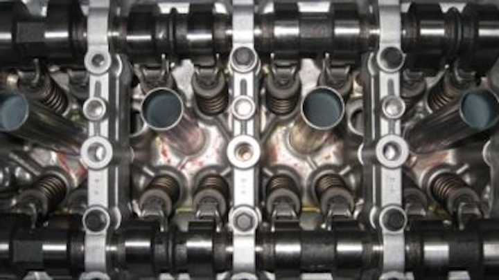 An automated machine-vision system designed by Olmec UK verifies the position of piston valve roller rocker arms in commercial automobile engines.