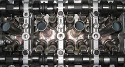 An automated machine-vision system designed by Olmec UK verifies the position of piston valve roller rocker arms in commercial automobile engines. An automated machine-vision system designed by Olmec UK verifies the position of piston valve roller rocker arms in commercial automobile engines.
