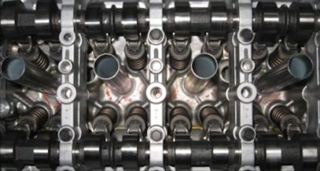 An automated machine-vision system designed by Olmec UK verifies the position of piston valve roller rocker arms in commercial automobile engines.