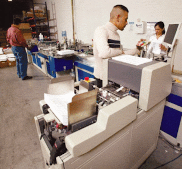 Scanning system speeds mail processing Vision Systems Design