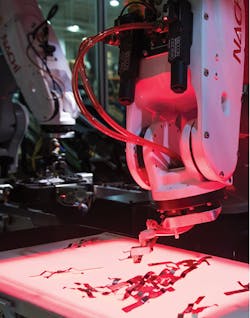 Figure 2: The machine vision system identifies pickable busbars in the right orientation and clear of parts around it and sends coordinates so that the robot can continually feed parts to the assembly operation in the background.