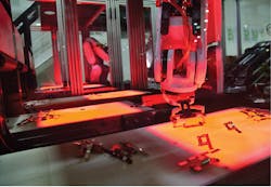 Figure 3: The busbar picking robot continually works with the vision system to pick the required busbars for each outlet build from three sorting conveyors with integrated backlighting. Figure 3: The busbar picking robot continually works with the vision system to pick the required busbars for each outlet build from three sorting conveyors with integrated backlighting.