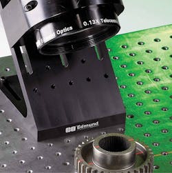 Figure 2: This image of an actual laser triangulation setup demonstrates how the laser line is projected over the 3D object. Figure 2: This image of an actual laser triangulation setup demonstrates how the laser line is projected over the 3D object.