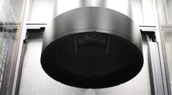 A large format, bi-telecentric lens provides a 240 mm field of view at a 375 mm working distance above the tray, where parts are gauged for required measurements.