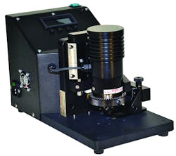 Figure 2: An operator bores into a metal sample to expose a crater in the paint thickness, enabling the capture of multiple images for measurement. Figure 2: An operator bores into a metal sample to expose a crater in the paint thickness, enabling the capture of multiple images for measurement.
