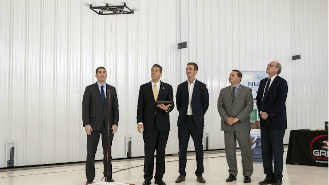 Governor Andrew Cuomo (second from left) tries his hand at drone piloting.