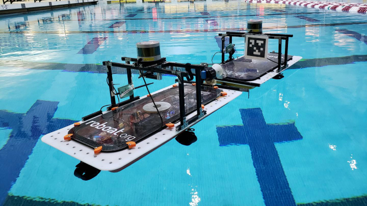 Figure 1. Two roboats practice docking maneuvers in a swimming pool at the Massachusetts Institute of Technology.