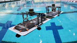 Figure 1. Two roboats practice docking maneuvers in a swimming pool at the Massachusetts Institute of Technology.