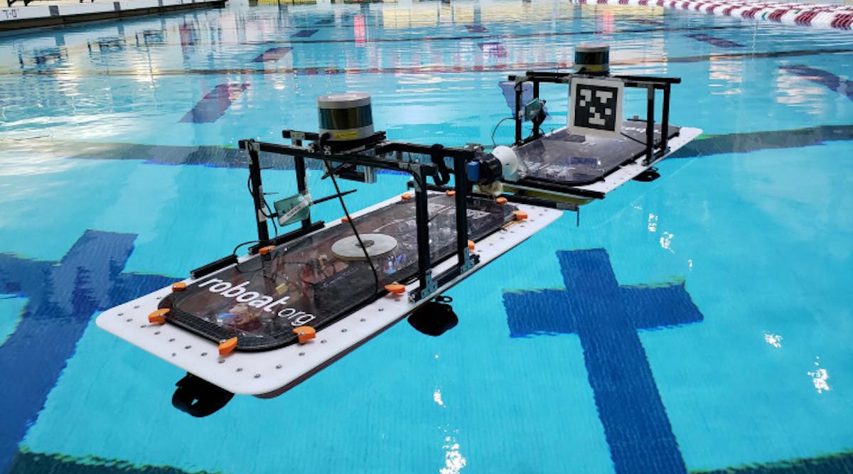 Figure 1. Two roboats practice docking maneuvers in a swimming pool at the Massachusetts Institute of Technology.