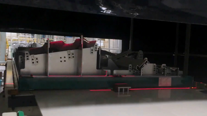 Figure 1: Two 3D profile sensors scan trays full of automotive parts from overhead as the tray moves along a conveyor.