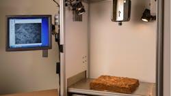 Figure 1. The leaf blend grade verification system consists of an enclosure, tungsten halogen lamps, a cooling fan, and a hyperspectral camera. Figure 1. The leaf blend grade verification system consists of an enclosure, tungsten halogen lamps, a cooling fan, and a hyperspectral camera.