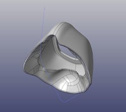 Figure 2: A custom-fit respirator 3D prints on a FormLabs printer for the initial design of the custom-fit respirator. Figure 2: A custom-fit respirator 3D prints on a FormLabs printer for the initial design of the custom-fit respirator.