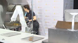 Figure 1: Miso Robotics&rsquo; Flippy robot works the grill station alongside an employee at CaliBurger in Pasadena, CA, USA. Image credit: Miso Robotics.