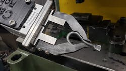 Figure 4: A collaborative robot picks up a small hook from a bin but must then place the hook onto a peg fixture so that the robotic arm and gripper can properly reorient and grip the hook for placement into the press. Figure 4: A collaborative robot picks up a small hook from a bin but must then place the hook onto a peg fixture so that the robotic arm and gripper can properly reorient and grip the hook for placement into the press.