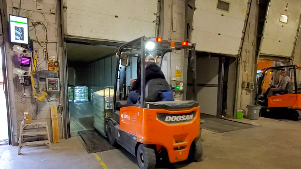 Barcode scanning vision system provides accuracy for warehouse truck