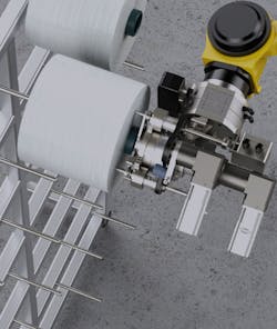 The robot needs to be positioned within 1 mm of an exact spot to pick up a bobbin and load it on a mandrel, or pin. The robot needs to be positioned within 1 mm of an exact spot to pick up a bobbin and load it on a mandrel, or pin.