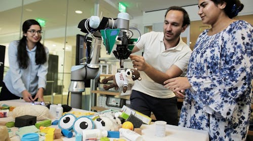 MIT researchers demonstrate FuseBot, a robotic arm and gripper, as it retrieves a hidden item from a pile. Pictured are Research Assistant Tara Boroushaki, Associate Professor Fadel Abid, and Research Assistant Nazish Naeem. (Photo courtesy of MIT.)