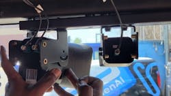 The two-camera system from Hayden AI is mounted on the windshield of public buses in the New York area.