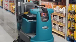 The autonomous robot scrubs floors and scans inventory at Sam's Club.