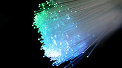 Fiber optics transmit data as pulses of light through strands of fiber made of glass or plastic. Fiber optics transmit data as pulses of light through strands of fiber made of glass or plastic.