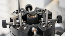 Figure 4: Manual adjustment of an element within a microscope objective during active alignment. These types of adjustments would not be made during the assembly of a drop together system.