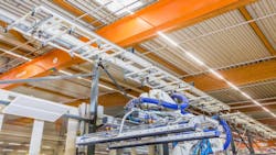 Figure 2: A robotic cell and vision system coordinates the placement and positioning of sheets used in wall fabrication. Figure 2: A robotic cell and vision system coordinates the placement and positioning of sheets used in wall fabrication.