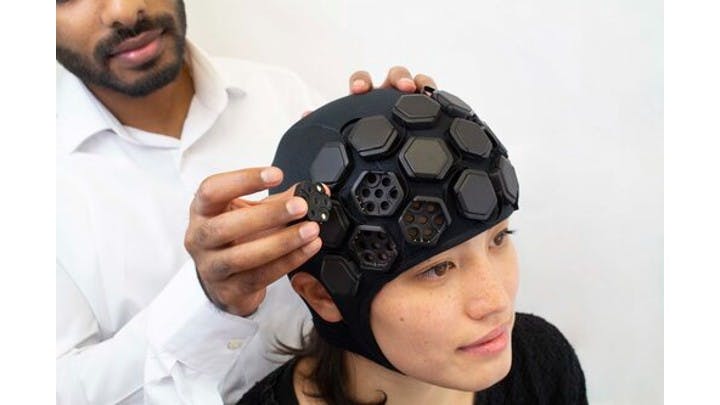 Figure 1: The researchers use LUMO, a wearable, portable, high-density functional NIR imaging device equipped with modular tiles with built-in NIR light sources and detectors.