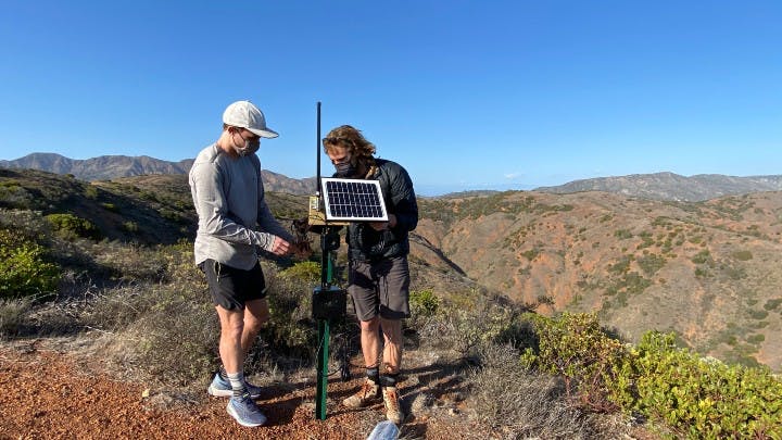 TNC staff troubleshooting a camera on Santa Cruz Island.