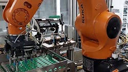 Figure 1: An industrial robot at Bosch&apos;s plant in Curitiba, Brazil, picks up injector nozzles and places them on a platform, allowing a vision system to capture images of codes engraved on the nozzles.