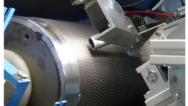 For this inspection system, a camera was mounted in a IP67 rated housing to prevent damage from carbon fiber dust. The camera and housing, along with an LED lighting unit, was mounted on a rack so the research team could manually position it to inspect card clothing used in textile carding machines..