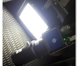 The camera captured and transmitted image data of card clothing to a nearby computer loaded with AI software, which analyzed wear in card tooth geometry, tooth tip condition, and density. The camera captured and transmitted image data of card clothing to a nearby computer loaded with AI software, which analyzed wear in card tooth geometry, tooth tip condition, and density.