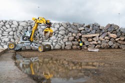 Figure 1: The Menzi Muck picked up and scanned each boulder as it built the wall. Figure 1: The Menzi Muck picked up and scanned each boulder as it built the wall.