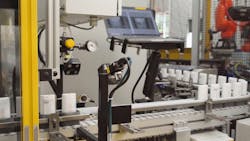 Figure 3: To inspect deodorant containers, Federal Package set up two cameras, with each one taking a picture of one side of a deodorant container as it moves through the line. Figure 3: To inspect deodorant containers, Federal Package set up two cameras, with each one taking a picture of one side of a deodorant container as it moves through the line.