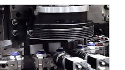 The inspection system checks bottle caps for cracks and flaws. The inspection system checks bottle caps for cracks and flaws.