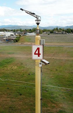 Figure 4: The automated system comprises five Teledyne FLIR A700 cameras that are installed with brackets on the same metal poles as the water cannons. They are strategically positioned around the storage pile. Figure 4: The automated system comprises five Teledyne FLIR A700 cameras that are installed with brackets on the same metal poles as the water cannons. They are strategically positioned around the storage pile.