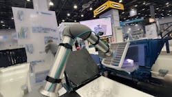 Figure 2: A robot at Photoneo's booth at Automate working on a task using a form of structured light to image the space. Figure 2: A robot at Photoneo's booth at Automate working on a task using a form of structured light to image the space.