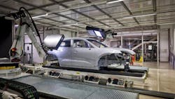 Figure 2: In the paint finishing area at Porsche's plant in Leipzig, Germany, each robot wields a 3D machine vision system inside an enclosure. Figure 2: In the paint finishing area at Porsche's plant in Leipzig, Germany, each robot wields a 3D machine vision system inside an enclosure.