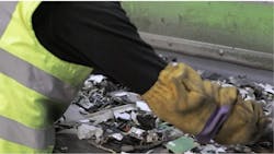 Fig. 3: An employee working a recycling line. At Sweeep's Sittingbourne, England, electronic/electrical recycling facility, human employees sift through waste material to salvage valuable recyclables and remove rubbish such as batteries. The detection system helps them locate and remove batteries, Fig. 3: An employee working a recycling line. At Sweeep's Sittingbourne, England, electronic/electrical recycling facility, human employees sift through waste material to salvage valuable recyclables and remove rubbish such as batteries. The detection system helps them locate and remove batteries,