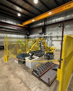 Figure 3: Penna Flame Industries purchased a FANUC R 2000/165F robot to automate the process of packaging leaf spring support arms. Figure 3: Penna Flame Industries purchased a FANUC R 2000/165F robot to automate the process of packaging leaf spring support arms.