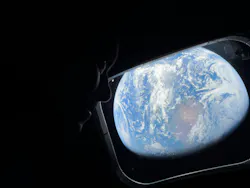 NASA astronaut and Artemis II Commander Reid Wiseman peers out of one of the Orion spacecraft’s main cabin windows NASA astronaut and Artemis II Commander Reid Wiseman peers out of one of the Orion spacecraft’s main cabin windows